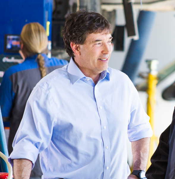 Troy speaking outdoors